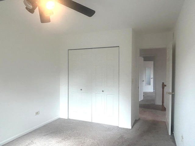 unfurnished bedroom featuring carpet flooring and ceiling fan