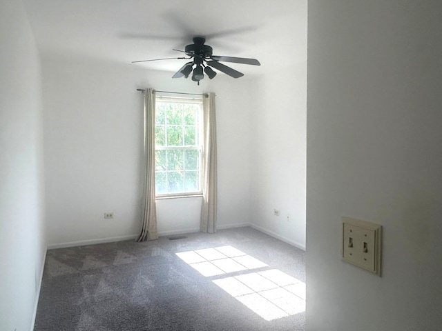 carpeted empty room with ceiling fan