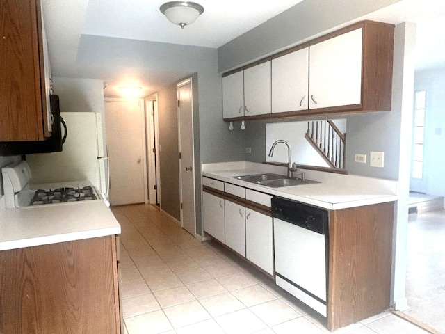 kitchen with sink, white cabinetry, and white appliances