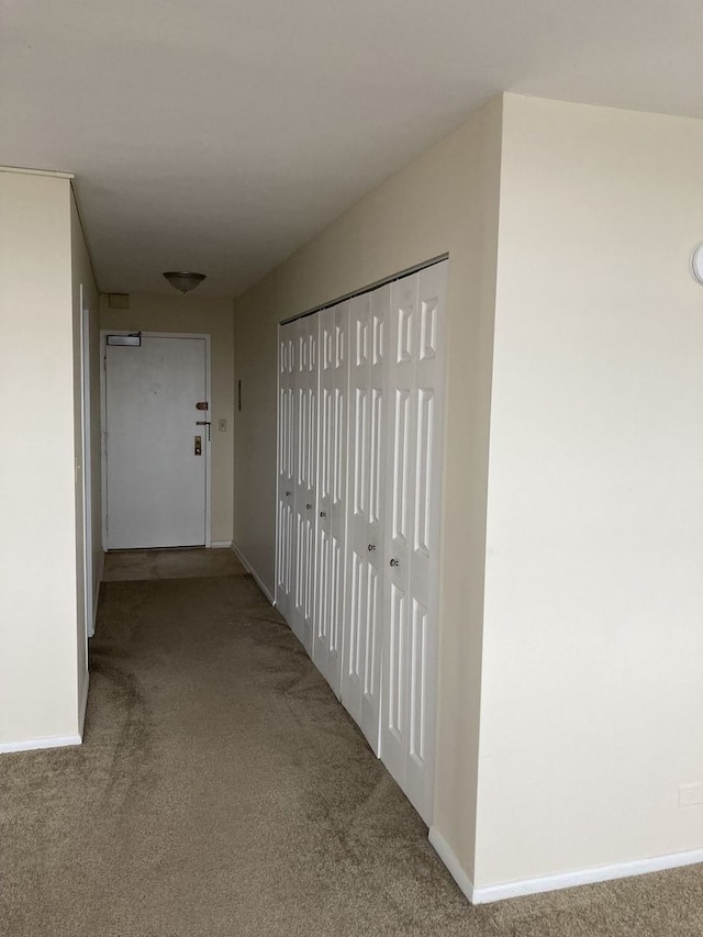 hallway with light carpet