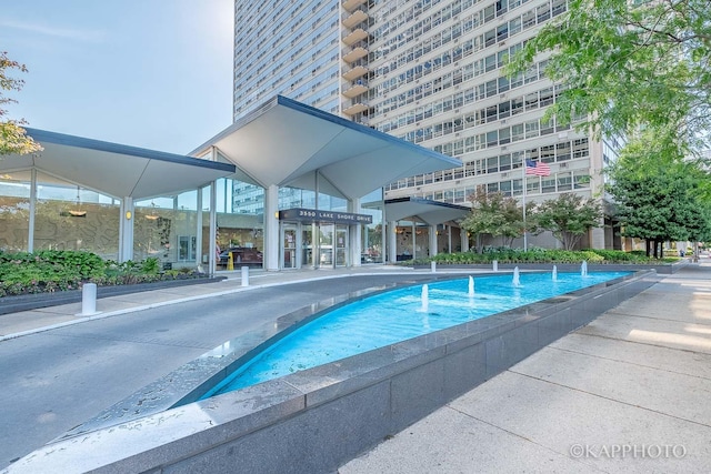 view of pool with pool water feature