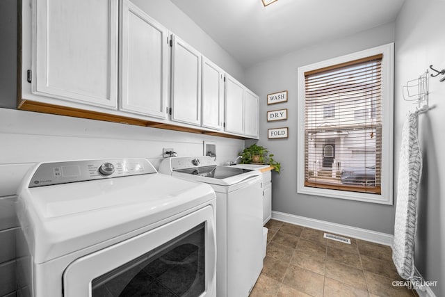 washroom with washer and clothes dryer, tile patterned flooring, cabinets, and sink