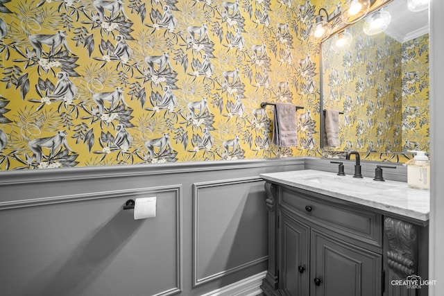 bathroom featuring vanity and crown molding