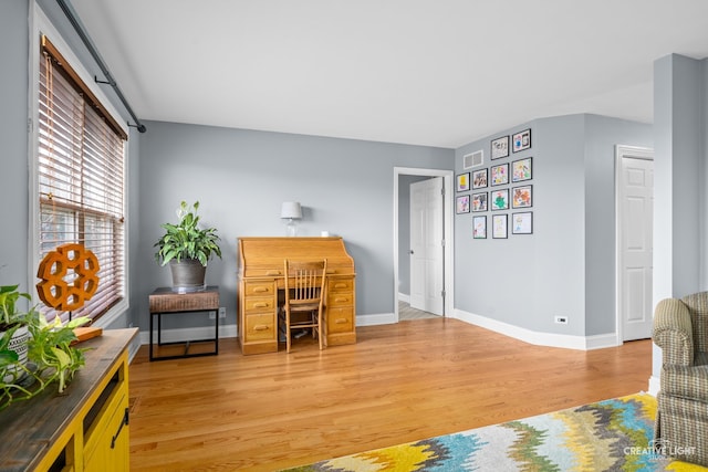 office space with hardwood / wood-style flooring