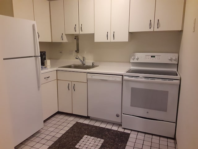 kitchen featuring white cabinetry, sink, light tile patterned floors, and white appliances