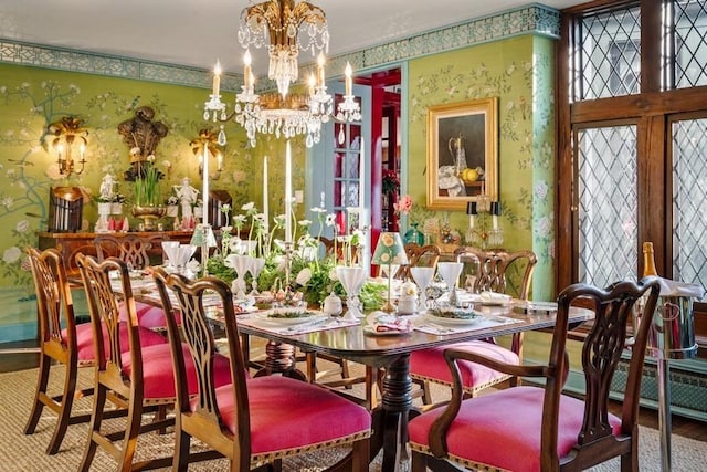 dining area with hardwood / wood-style flooring and a chandelier