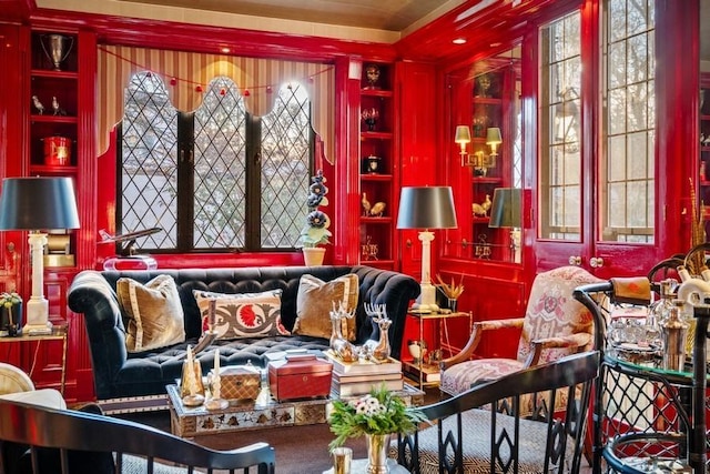 sitting room featuring carpet and built in shelves