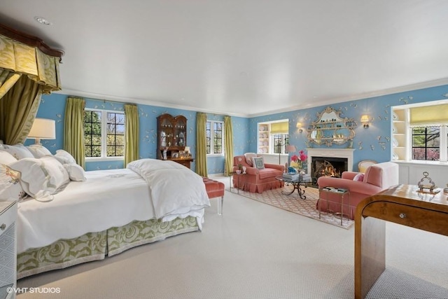 bedroom with crown molding and carpet floors