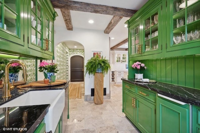 kitchen featuring sink, green cabinets, wine cooler, and beam ceiling