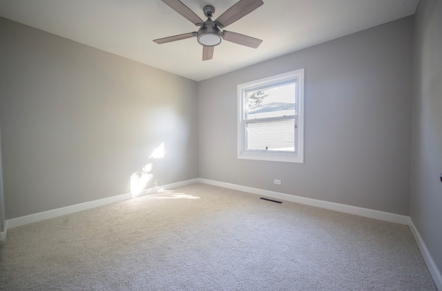 empty room with carpet and ceiling fan