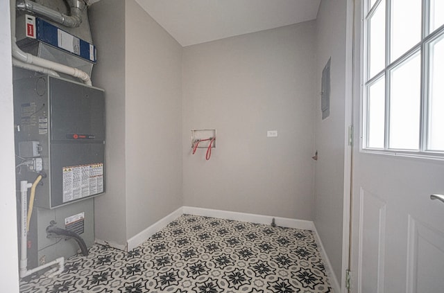 laundry room featuring heating unit