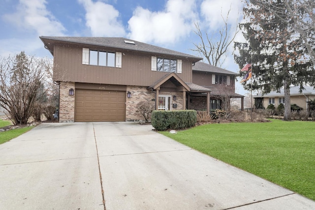 view of front facade with a garage and a front lawn