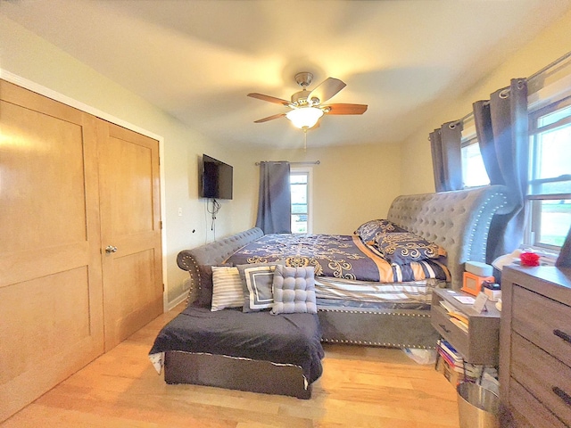 bedroom featuring light hardwood / wood-style floors and ceiling fan