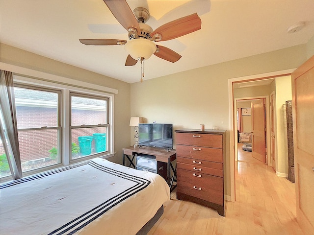 bedroom with light wood-type flooring and ceiling fan