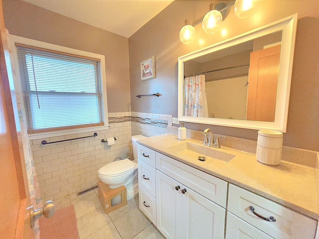 bathroom featuring tile walls, tile patterned flooring, vanity, and toilet