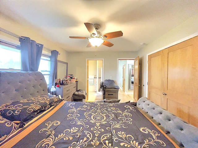 bedroom with ensuite bathroom, ceiling fan, and a closet