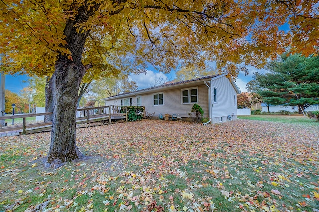 view of front of house with a wooden deck