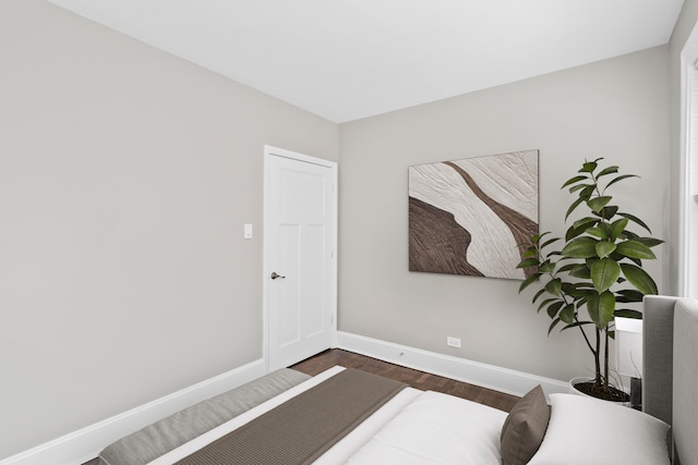 bedroom featuring dark wood-type flooring