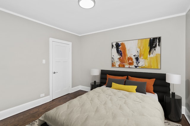 bedroom featuring dark wood-type flooring and crown molding