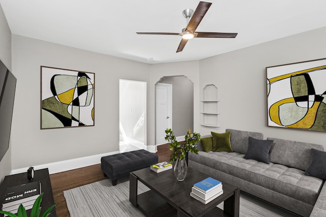 living room featuring hardwood / wood-style flooring and ceiling fan