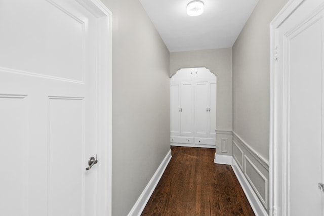 hall featuring dark wood-type flooring