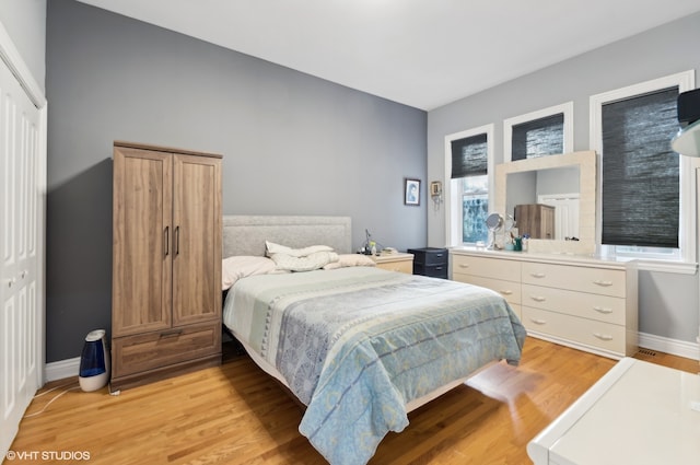 bedroom featuring light hardwood / wood-style floors and a closet