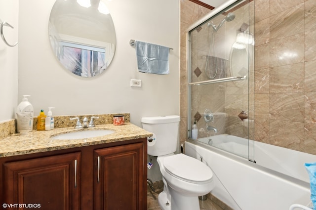 full bathroom with toilet, combined bath / shower with glass door, vanity, and tile patterned flooring