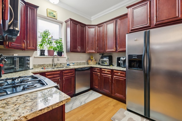 kitchen with light stone countertops, sink, stainless steel appliances, crown molding, and light hardwood / wood-style flooring