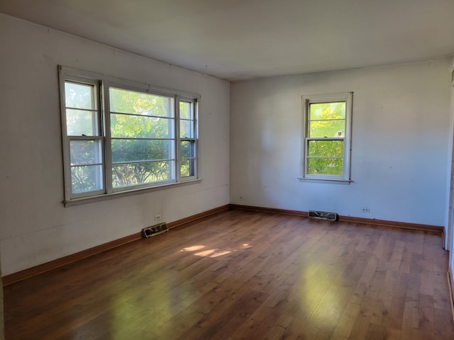 spare room featuring dark hardwood / wood-style floors