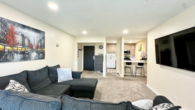 living room featuring light colored carpet