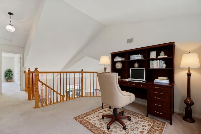 office featuring light carpet and vaulted ceiling