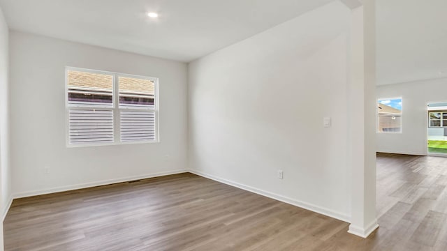 unfurnished room with light wood-type flooring