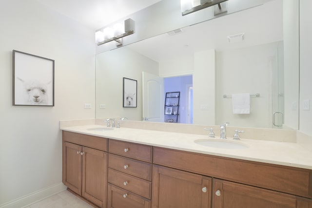 bathroom with vanity and tile patterned flooring