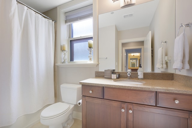 full bathroom with vanity, toilet, shower / bath combination with curtain, and tile patterned flooring