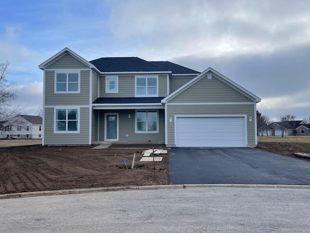 view of front of property featuring a garage