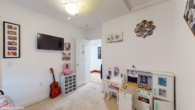 game room featuring light carpet