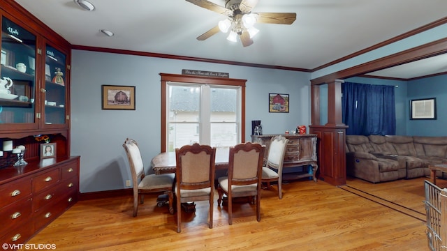 dining room featuring ceiling fan, light hardwood / wood-style floors, and ornamental molding