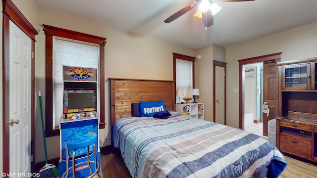 bedroom with ceiling fan and hardwood / wood-style floors