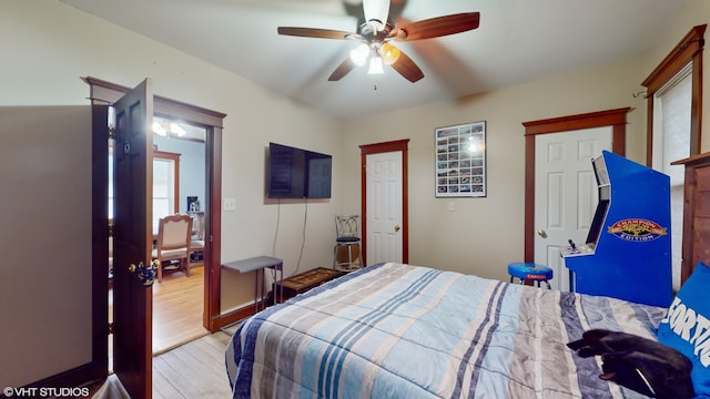 bedroom with light wood-type flooring and ceiling fan