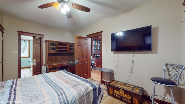 bedroom featuring light wood-type flooring and ceiling fan