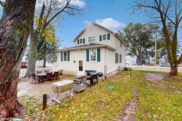 back of house featuring a patio