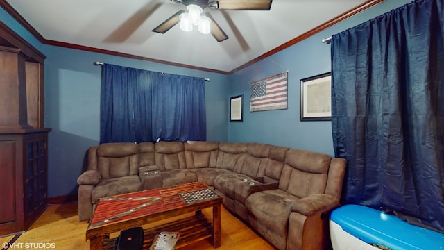 living room featuring lofted ceiling, ceiling fan, ornamental molding, and light hardwood / wood-style flooring