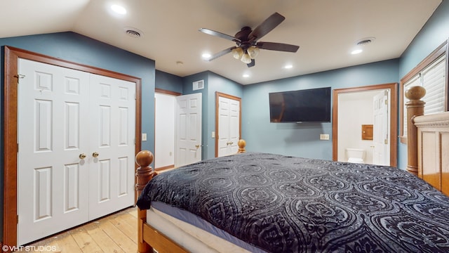 bedroom with ceiling fan, light wood-type flooring, and lofted ceiling