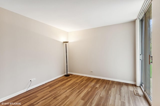 unfurnished room with a healthy amount of sunlight and light wood-type flooring