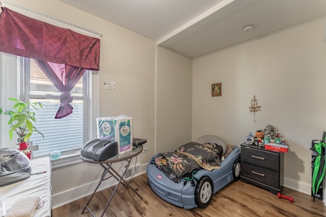 bedroom with hardwood / wood-style floors