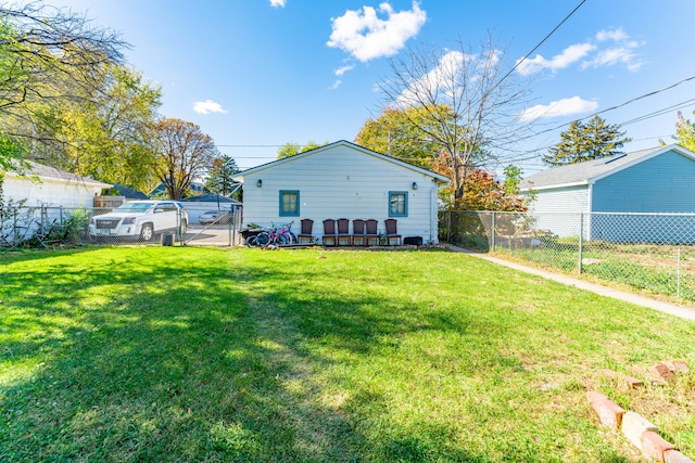 rear view of house with a lawn