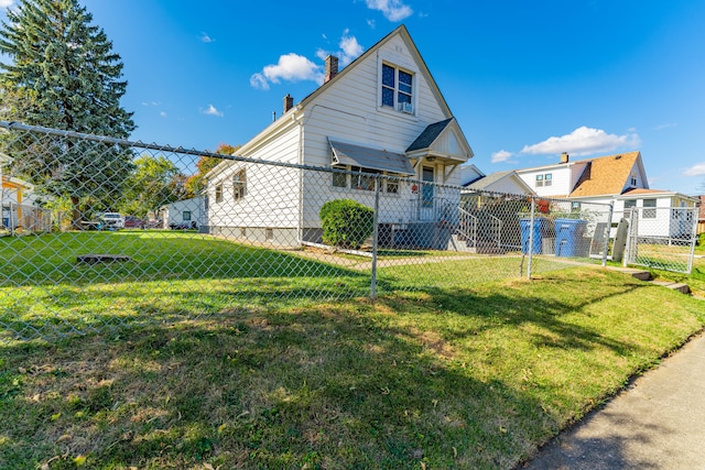 back of house featuring a yard