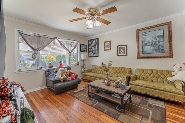 living room featuring crown molding, hardwood / wood-style flooring, and ceiling fan