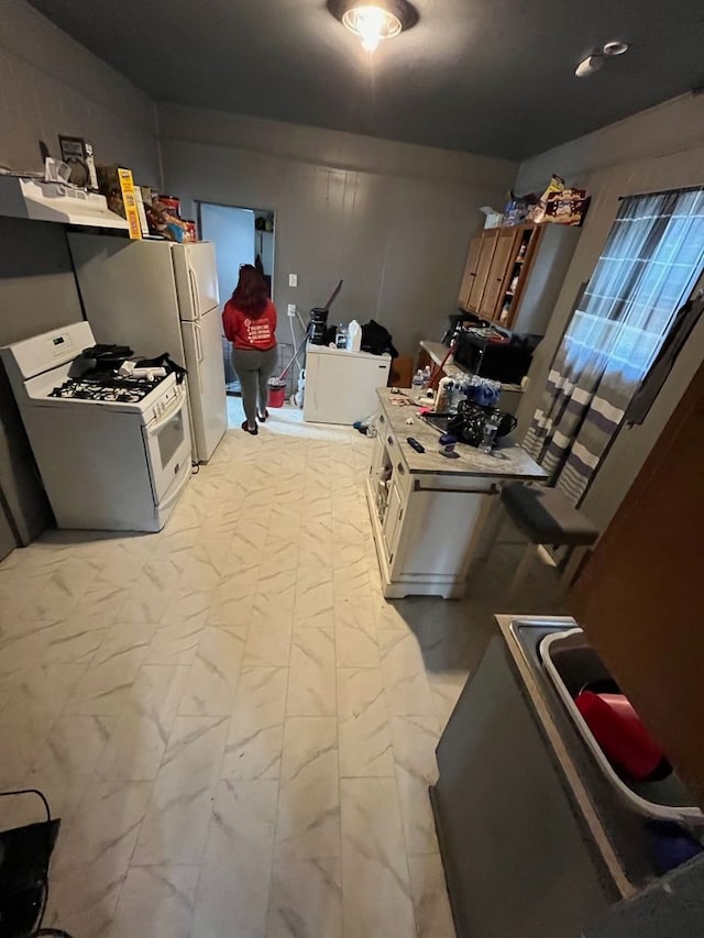 kitchen featuring white gas range