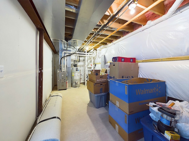 storage area featuring heating unit and gas water heater